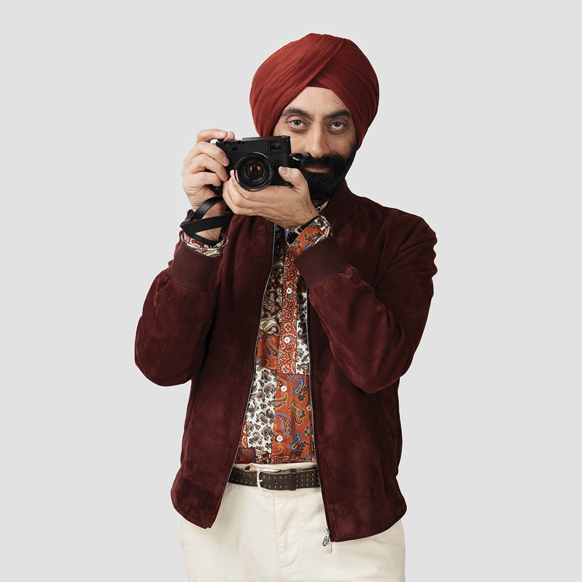 BD_GurmeetSingh_Standing_CameraUp_MaroonJacketAndTurban_PaisleyShirt_CreamPants copy