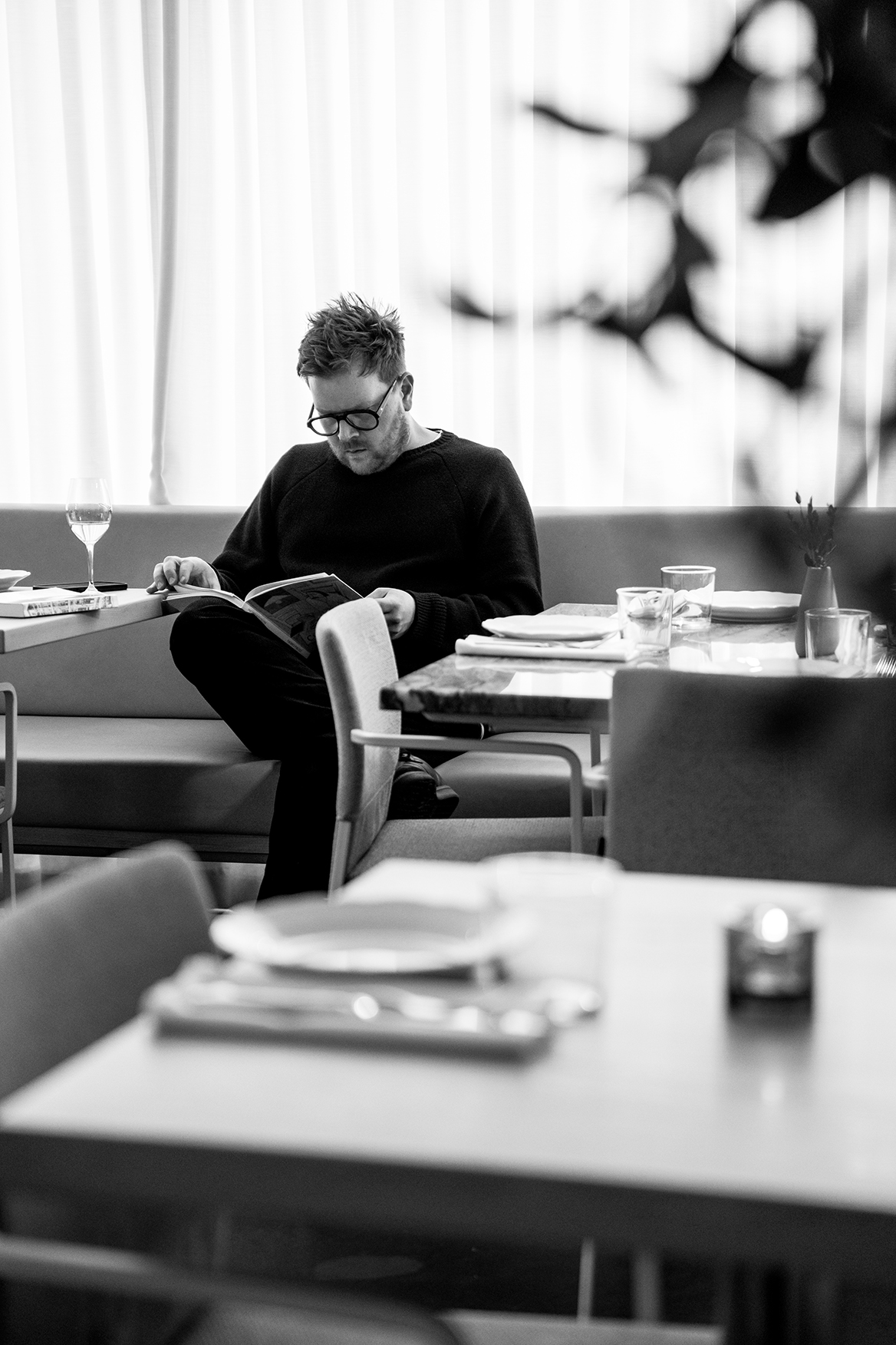 BR_Olia_BW_Man Sitting on BenchSeat Reading