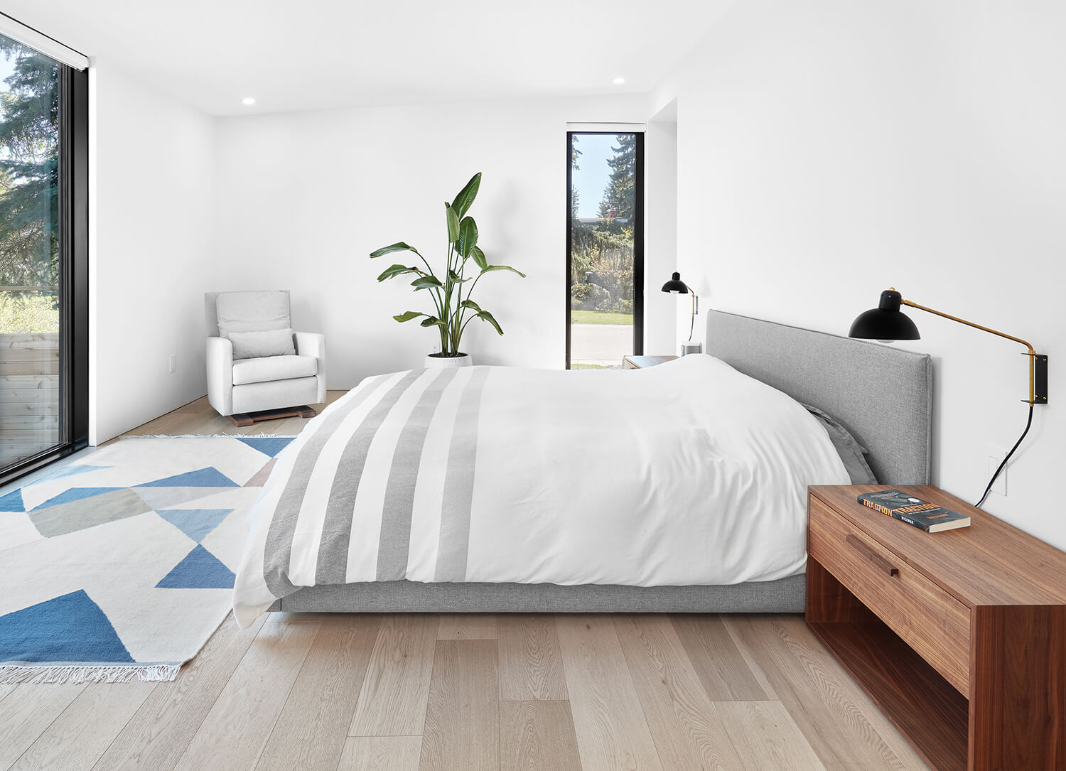 Bedroom_GreyBed_WoodenTable_LargeWindow