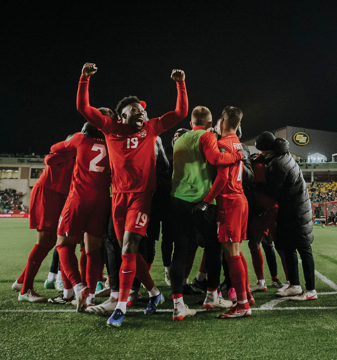 CheeringSoccerPlayersInGroup_AlphonsoDavies