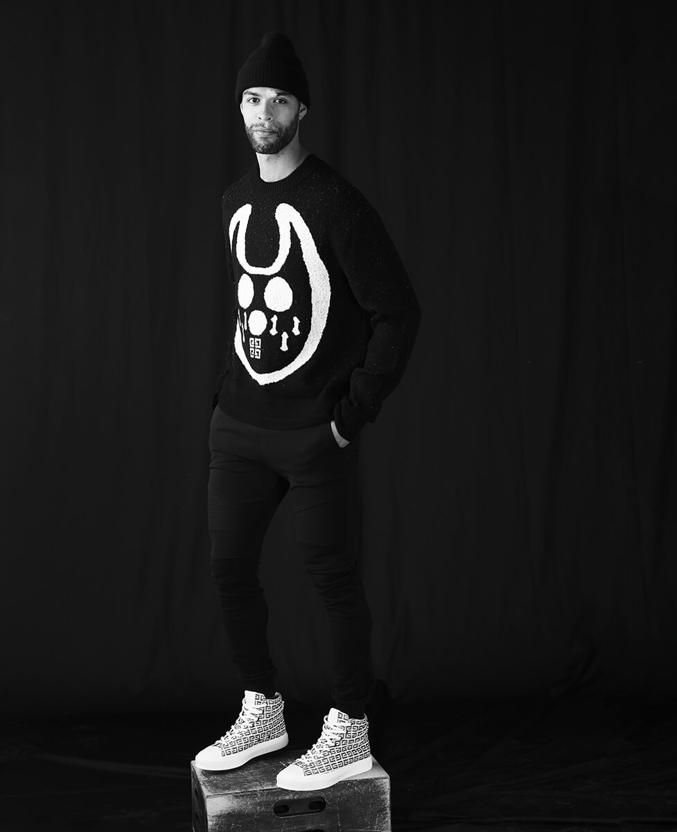 Darnel Nurse_Standing_BlackDevilSweater_BlackTuque Darnel Nurse_Standing_BlackDevilSweater_BlackTuque