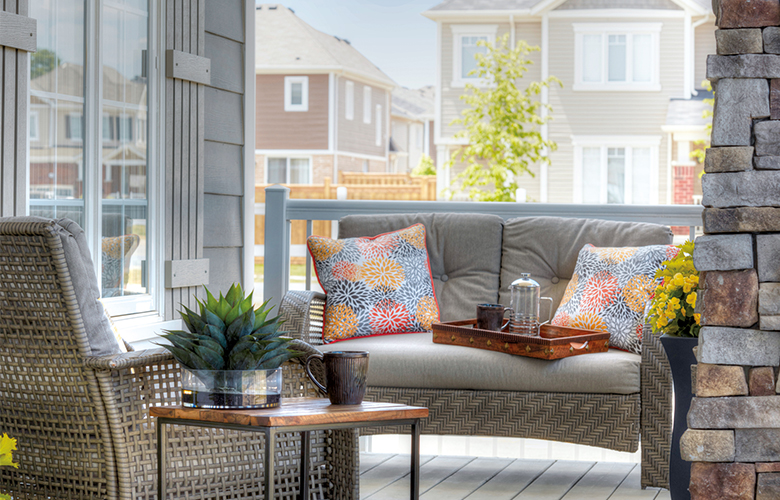 Front porch with sitting area overlooking the street.