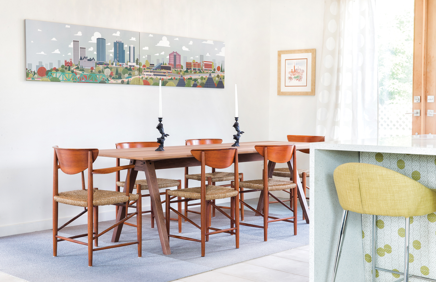 Chairs from Scandinavian Modern; table from IKEA; cityscape print by Jason Blower