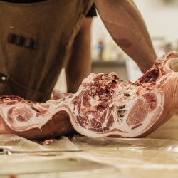 Pork being cut