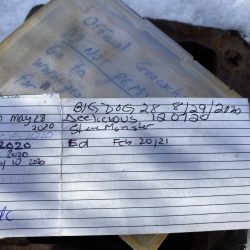 The contents of the imposter metal box with geocache log.