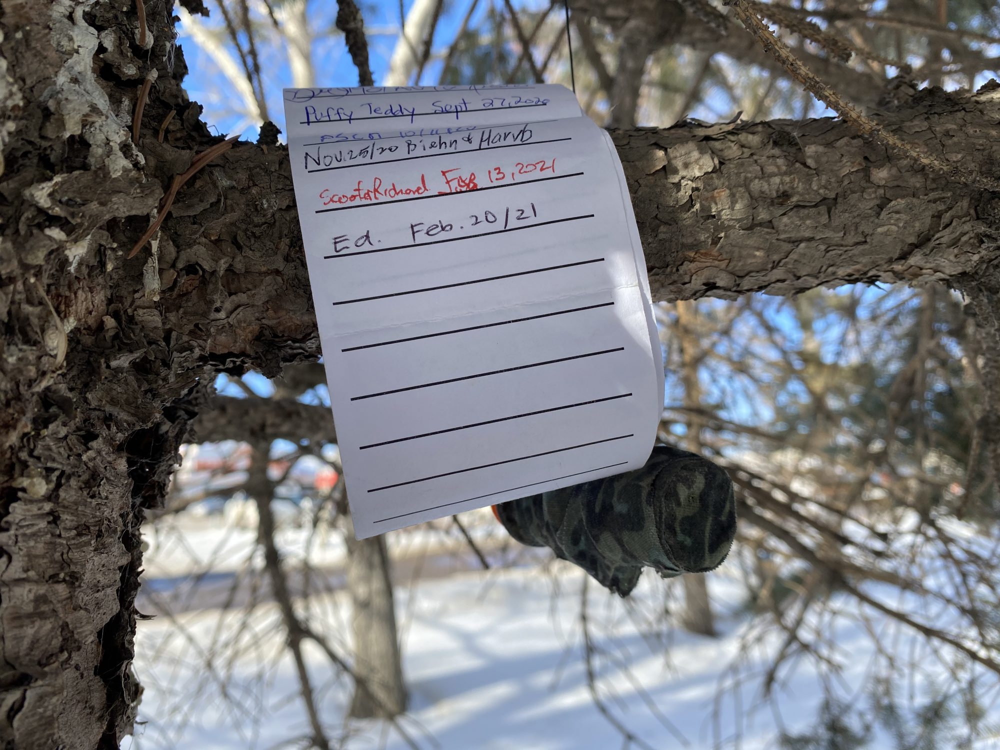 The unrolled geocache log, signed by Ed.