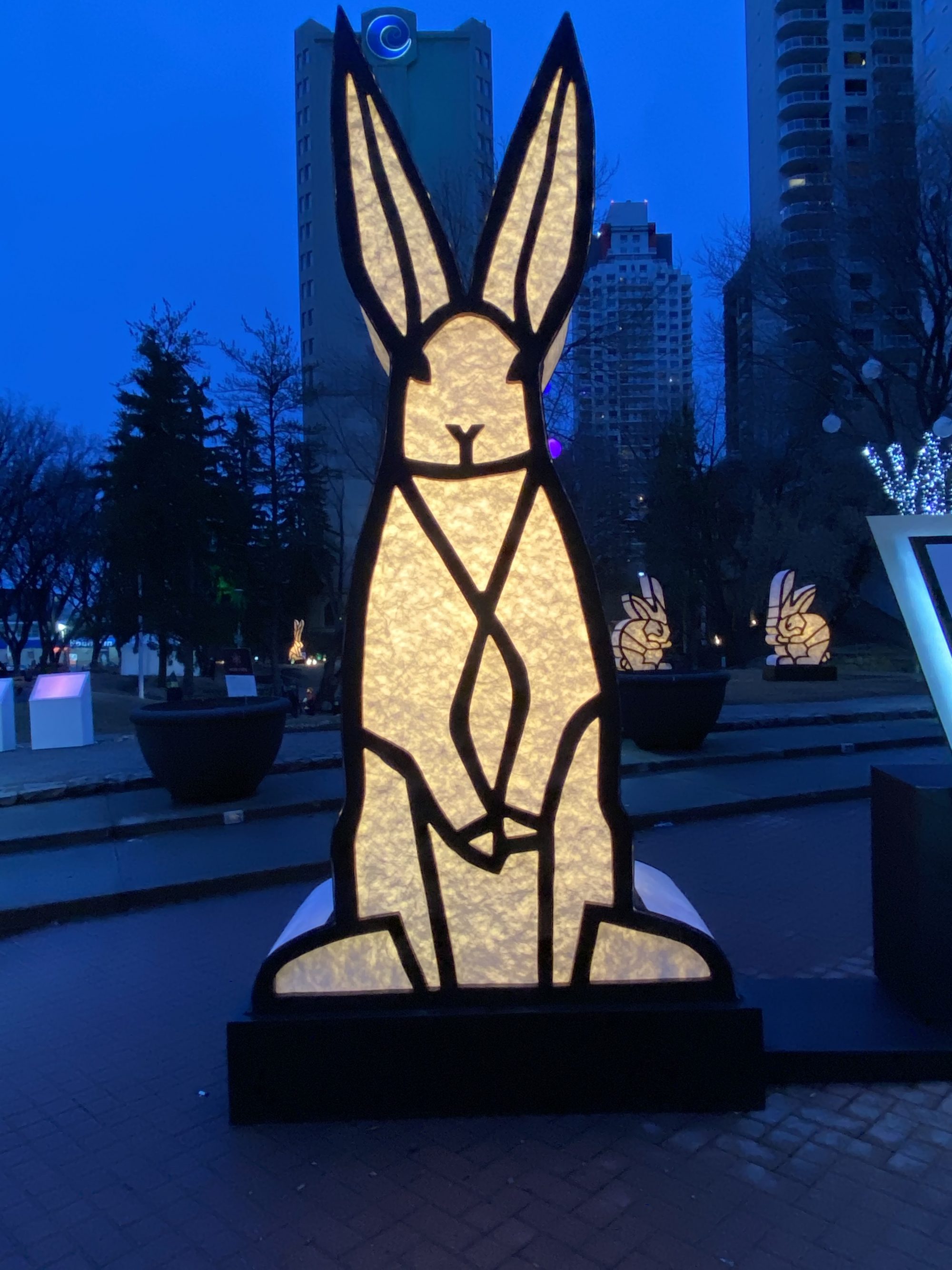  a sculpture of rabbit standing tall