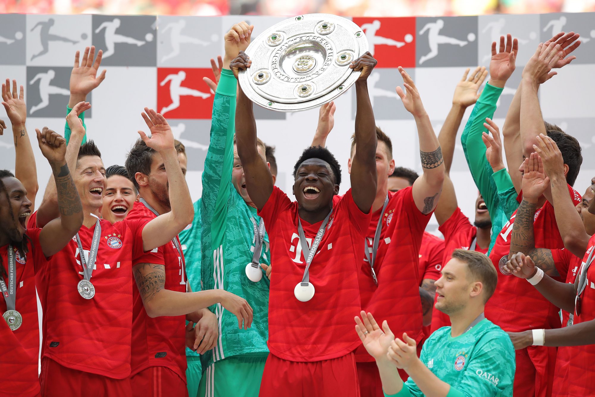 Alphonso Davies and his Bayern Munich teammates celebrate the Bundesliga title.