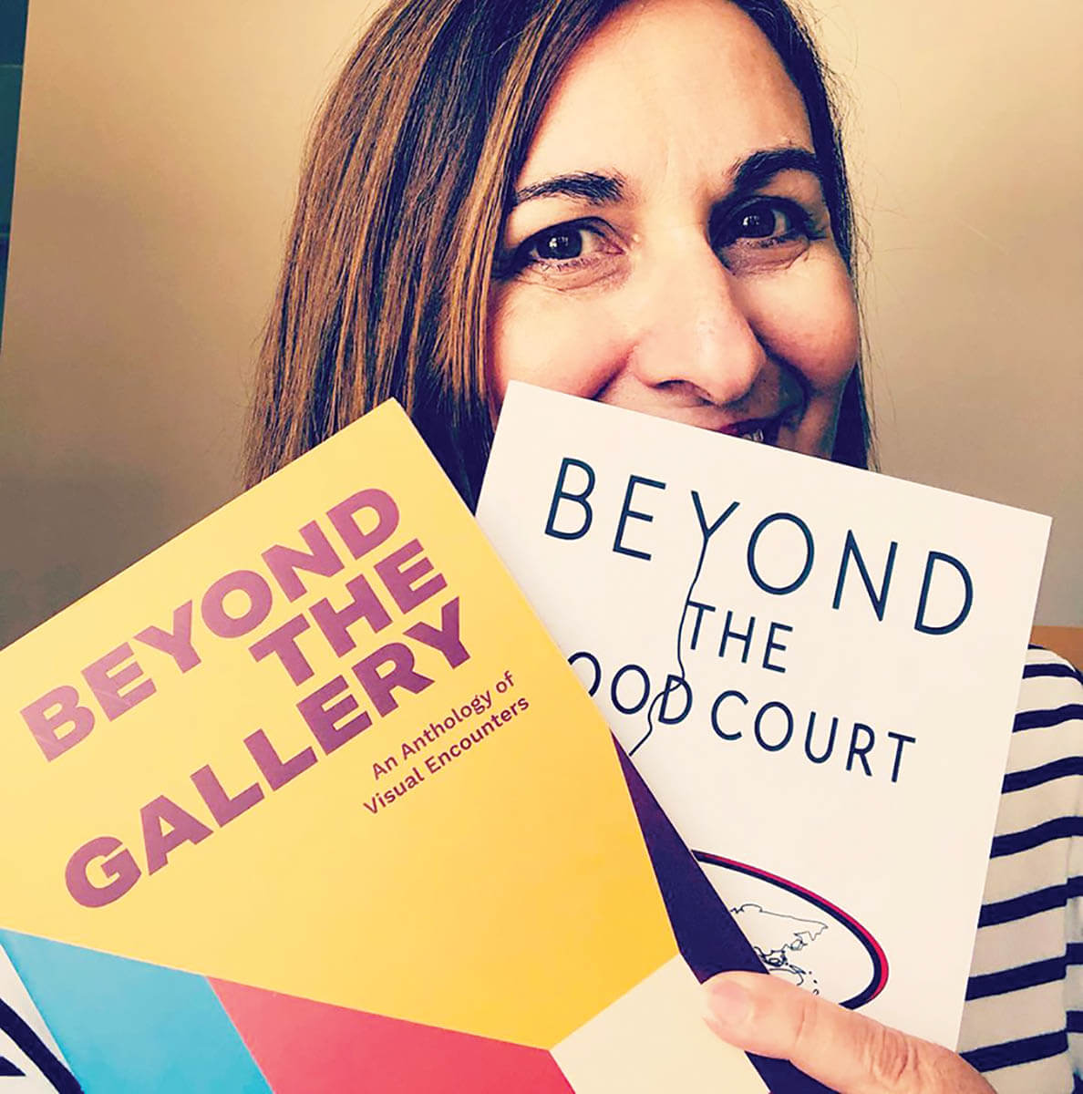 LaberintoPress_LucianaErregue-Sacchi_With2BooksFannedInFrontOfFace