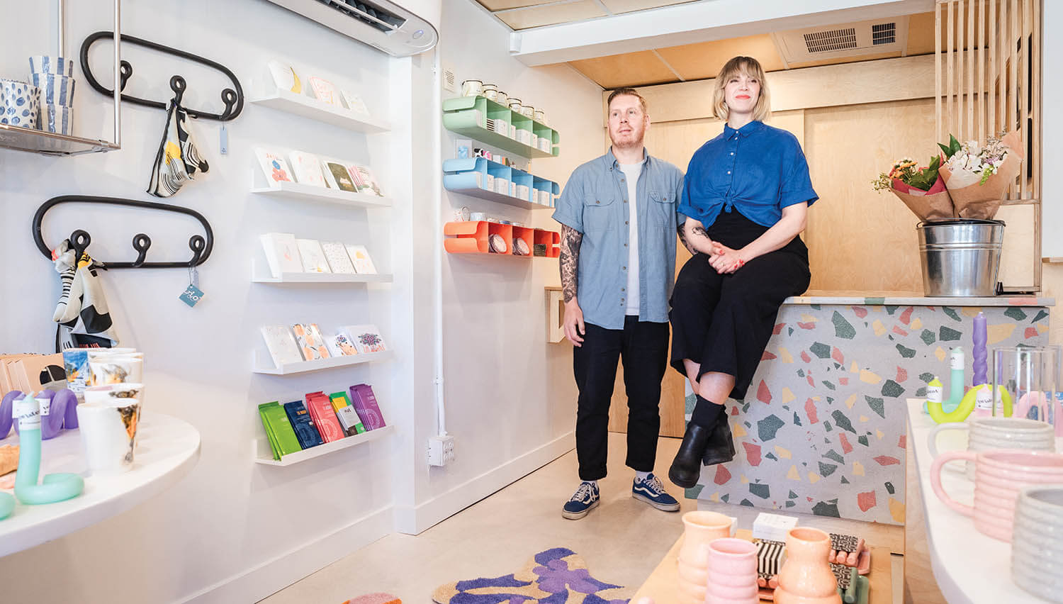 Lot34_InsideShop_TylerDayStanding_LindsayJonesSittingOnCounter