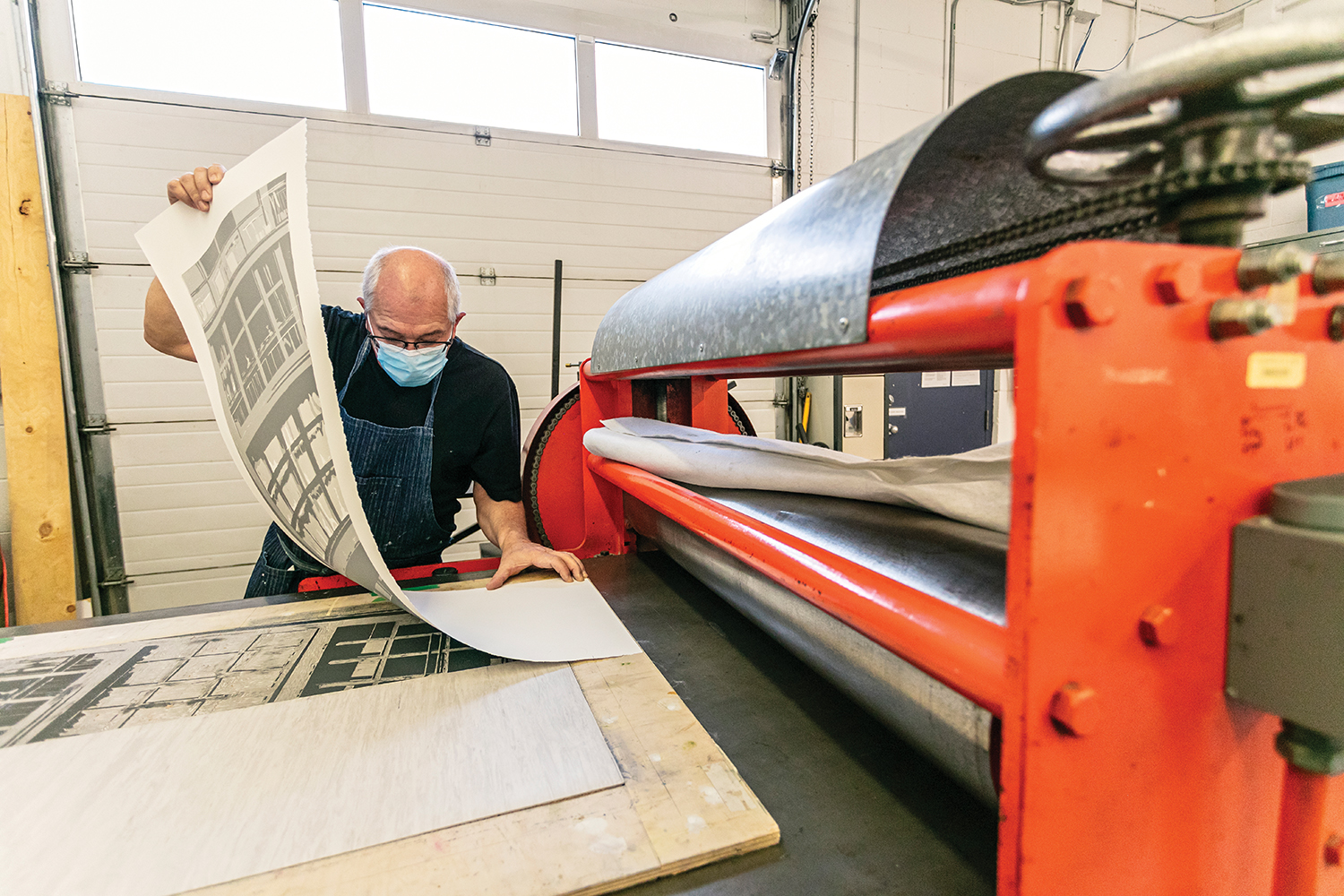 SNAP artist Richard Borowski working on a relief print on the Orange Glen Alps press