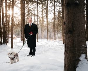 Richard Secord walking a dog