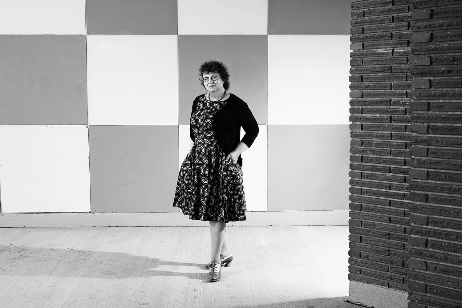 SenatorSimons_CheckerboardWall__Standing_BW