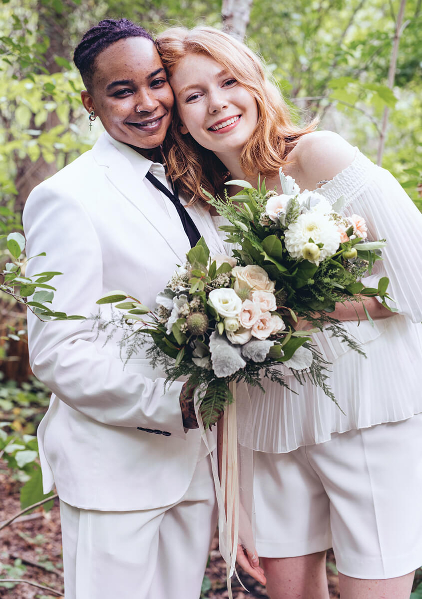 TwoBridesAt TheirWedding_WhiteBouquets