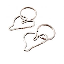 Silver heart-shaped hoop earrings by Karyn Chopik, $85, from The Tin Box.