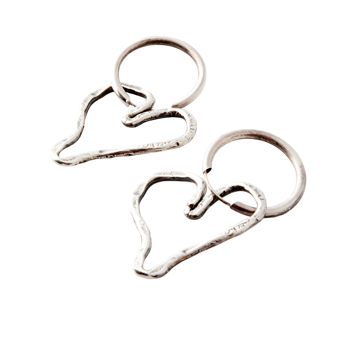 Silver heart-shaped hoop earrings by Karyn Chopik, $85, from The Tin Box.
